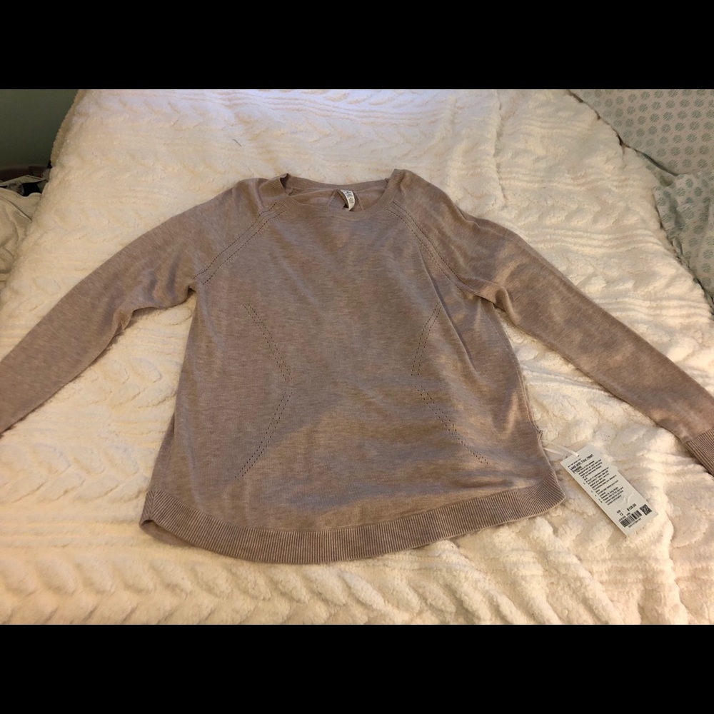 Light pink Lululemon sweater with tags